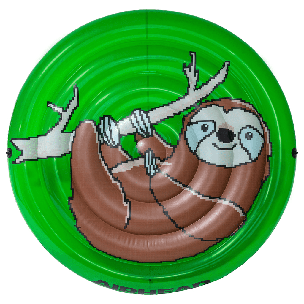 top view of a green circular float with a pixelated smiling sloth hanging from a branch