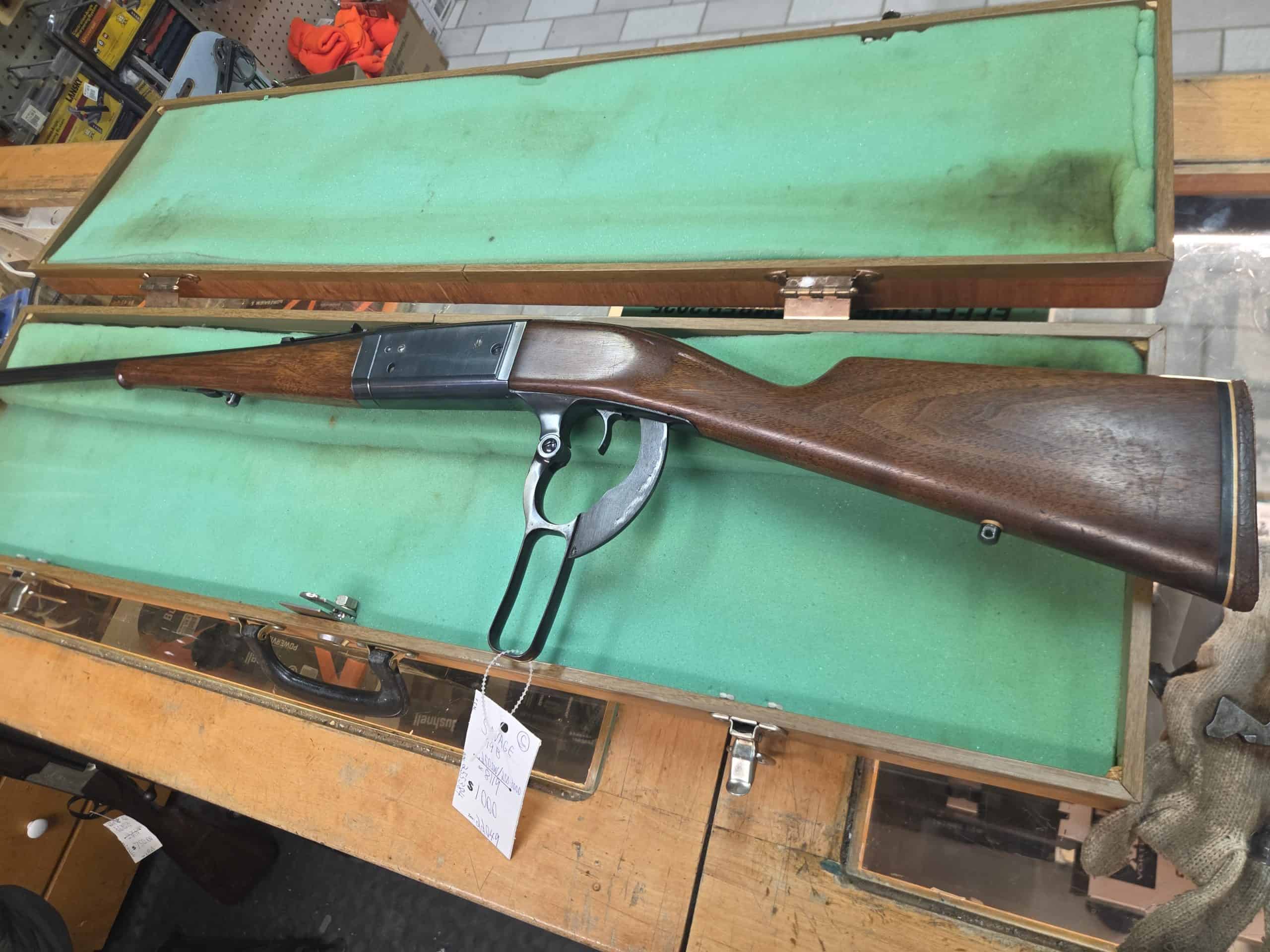 Savage 1 20261018_094349 Savage Model 99 lever-action rifle with a wood stock in an open green-lined hard case.