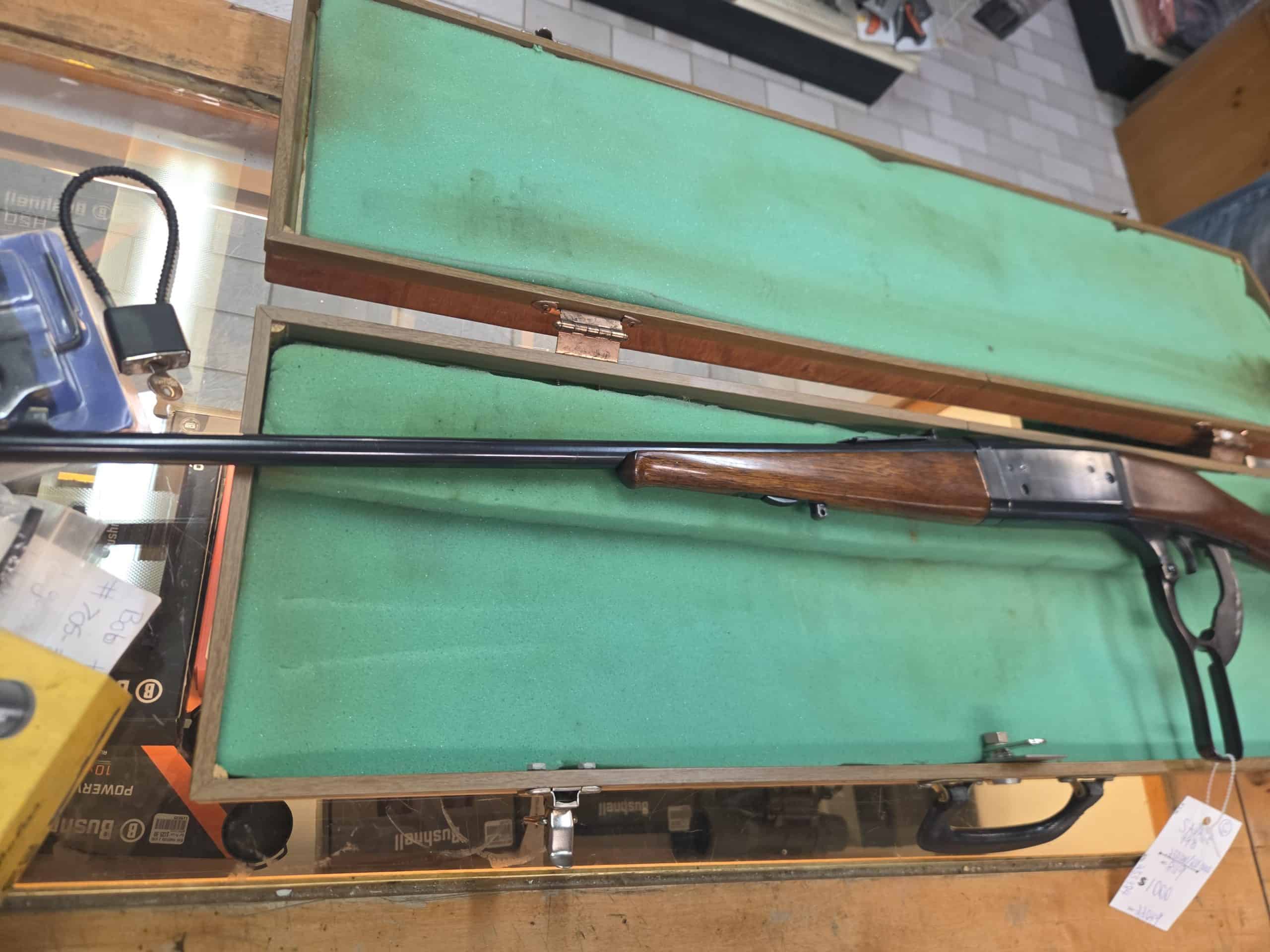 Savage 4 20261018_094354 lever-action rifle in a wooden case with a green felt lining.